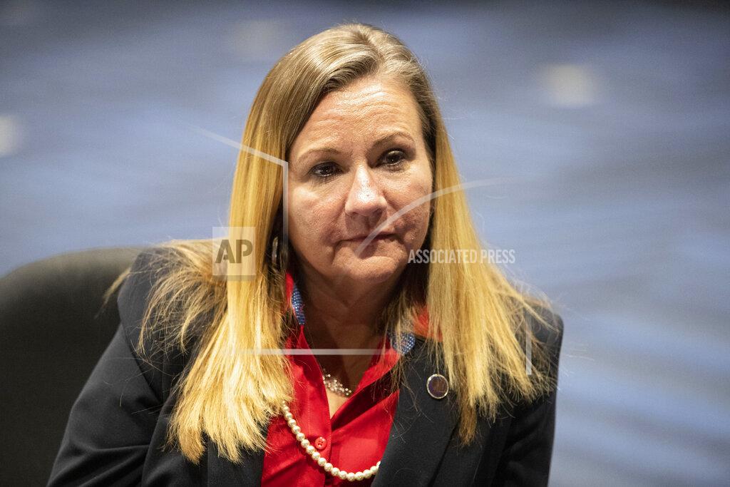 In this Feb. 2, 2021, photo, Virginia Sen. Amanda Chase and Republican gubernatorial candidate, speaks from her desk at the Science Museum of Virginia in Richmond, Va. The national Republican Party is at war with itself, struggling to reconcile a bitter divide between former President Donald Trump’s fierce loyalists and those who want Trumpism purged from their party. Chase is a polarizing state senator who seems to have won the hearts and minds of the Trump faithful with her fiercely anti-establishment, pro-gun positions and her embrace of the false notion that Trump is the legitimate winner of the November election. (AP Photo/Ryan M. Kelly)