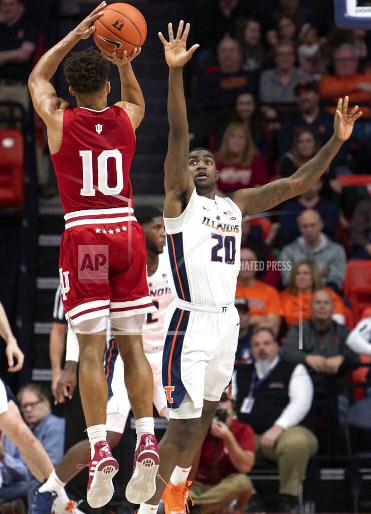 Stephen Haas Illinois guard Da'Monte Williams (20) defends against a shot from Indiana guard Rob Phinisee (10) during the first half of an NCAA college basketball game in Champaign, Ill., Thursday, March 7, 2019. (AP Photo/Stephen Haas)