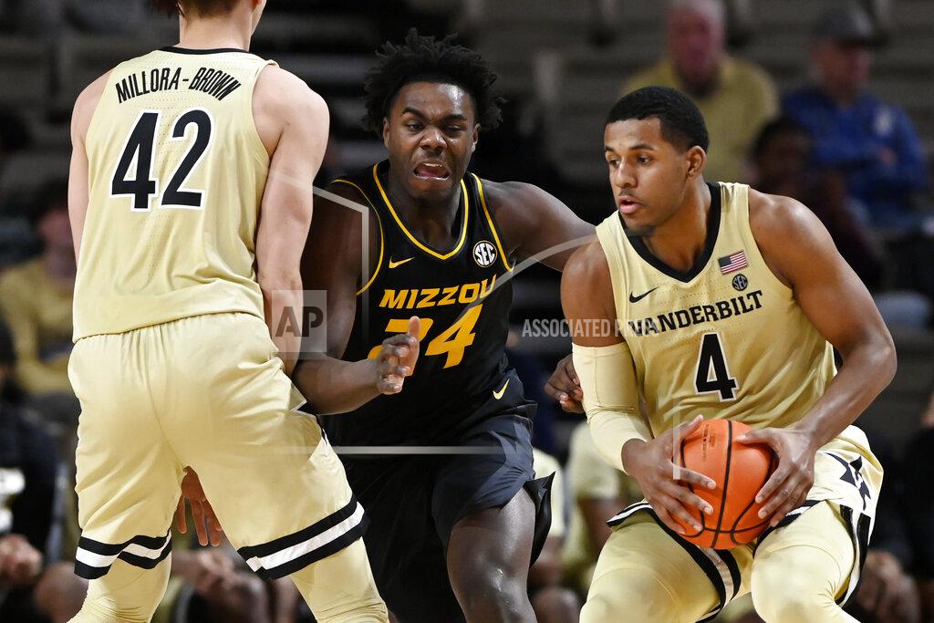 Mark Zaleski Missouri forward Kobe Brown (24) fights through a screen by Vanderbilt forward Quentin Millora-Brown (42) as he tries to defend against Vanderbilt forward Jordan Wright (4) during the second half of an NCAA college basketball game Tuesday, Feb. 8, 2022, in Nashville, Tenn. Vanderbilt won 70-62. (AP Photo/Mark Zaleski)