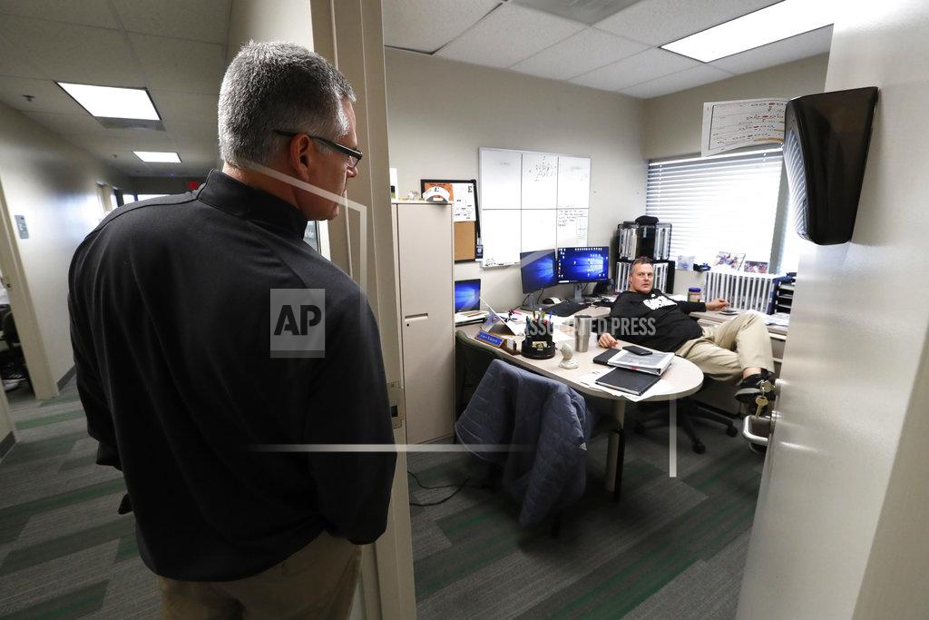 Paul Sancya Eastern Michigan football coach Chris Creighton, left, talks with defensive coordinator Neal Neathery in preparation for the Camellia Bowl, in Ypsilanti, Mich., Monday, Dec. 10, 2018. Eastern Michigan's football team has stepped out of the shadows created by the neighboring University of Michigan and four professional teams just down the road in the Motor City. (AP Photo/Paul Sancya)