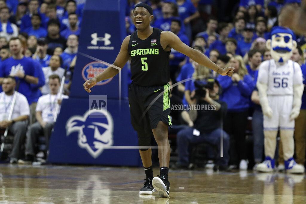 Adam Hunger Michigan State guard Cassius Winston (5) reacts after making a basket during the first half of an NCAA college basketball game against Seton Hall on Thursday, Nov. 14, 2019, in Newark, N.J. (AP Photo/Adam Hunger)