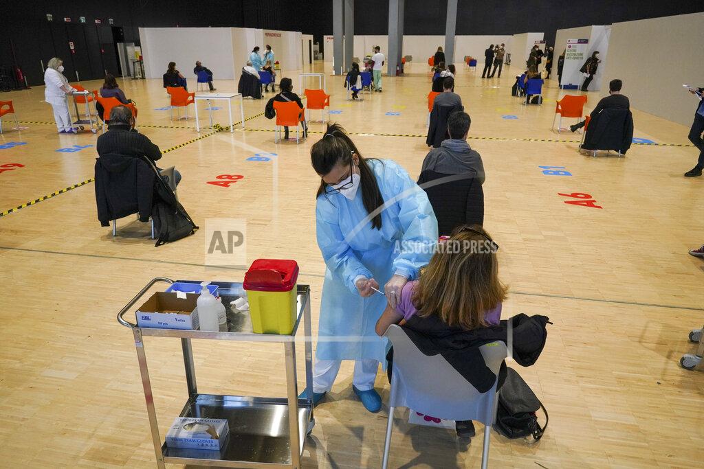 Andrew Medichini Health workers administer doses of the AstraZeneca vaccine against COVID-19 inside the convention center known as "La Nuvola", The Cloud, in Rome, Wednesday, March 10, 2021. The visually extraordinary complex designed by famed architect Massimiliano Fuksas has been transformed into a temporary vaccination center. (AP Photo/Andrew Medichini)