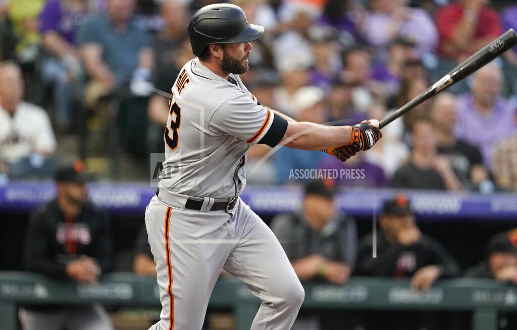 David Zalubowski San Francisco Giants' Darin Ruf connects for an RBI-single off Colorado Rockies starting pitcher Chad Kuhl in the third inning of a baseball game Tuesday, May 17, 2022, in Denver. (AP Photo/David Zalubowski)