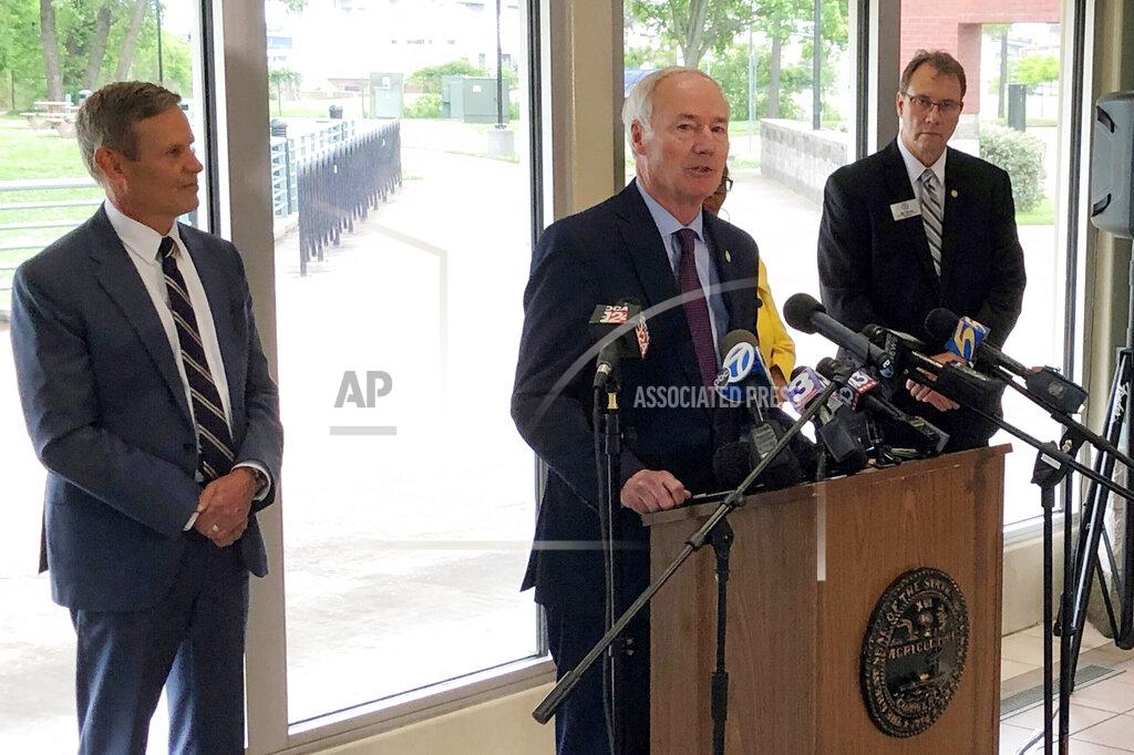 Adrian Sainz Arkansas Gov. Asa Hutchinson speaks with reporters about the closure of the Interstate 40 bridge connecting his state with Tennessee, Tuesday, May 18, 2021, in Memphis, Tenn. Tennessee Gov. Bill Lee, left, also updated reporters about the bridge closure. (AP Photo/Adrian Sainz)