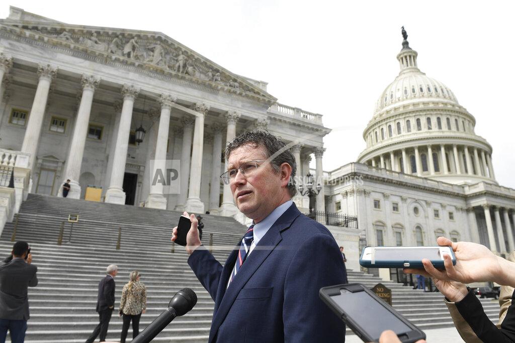 Susan Walsh Rep. Thomas Massie, R-Ky., talks to reporters before leaving Capitol Hill in Washington, Friday, March 27, 2020. The nation's fiercest fiscal conservatives are largely embracing the massive economic rescue package moving through Congress. In many cases, those conservatives who support the $2 trillion coronavirus spending bill are the very same who raged against the $800 billion economic stimulus package backed by the Obama administration after the 2008 financial crisis. (AP Photo/Susan Walsh)