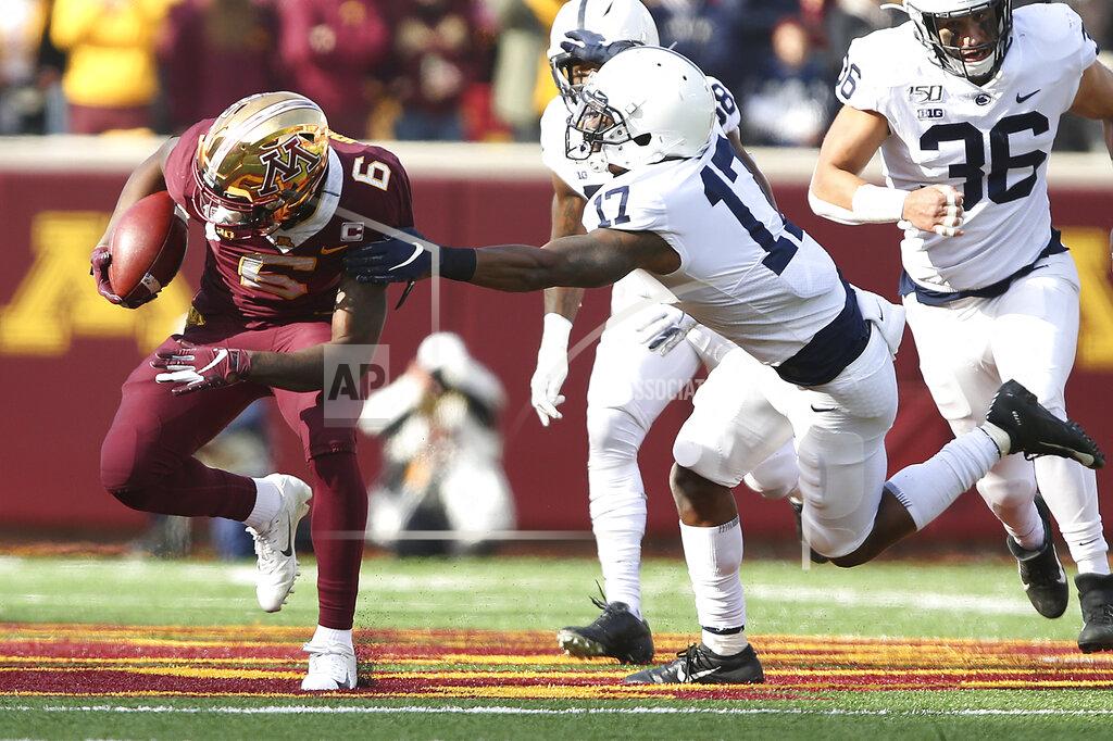 Stacy Bengs Minnesota wide receiver Tyler Johnson (6) escapes a tackle from Penn State safety Garrett Taylor (17) during an NCAA college football game, Saturday, Nov. 9, 2019, in Minneapolis. (AP Photo/Stacy Bengs)
