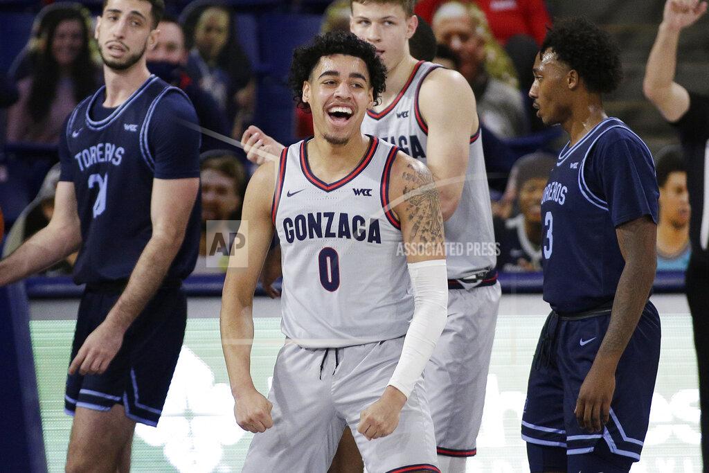 Gonzaga guard Julian Strawther celebrates his basket during the second half of an NCAA college basketball game against San Diego in Spokane, Wash., Saturday, Feb. 20, 2021. (AP Photo/Young Kwak)