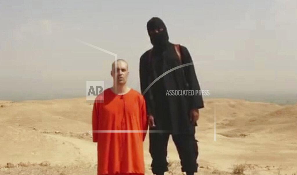 Uncredited FILE - This undated image made from video released by Islamic State militants on Tuesday, Aug. 19, 2014, purports to show journalist James Foley before he was killed by the militant group. The family of slain American journalist Steven Sotloff filed a federal lawsuit Friday, May 13, 2022, accusing prominent Qatari institutions of wiring $800,000 to an Islamic State “judge” who ordered the murder of Sotloff and another American journalist, James Foley. (Militant website via AP, File)
