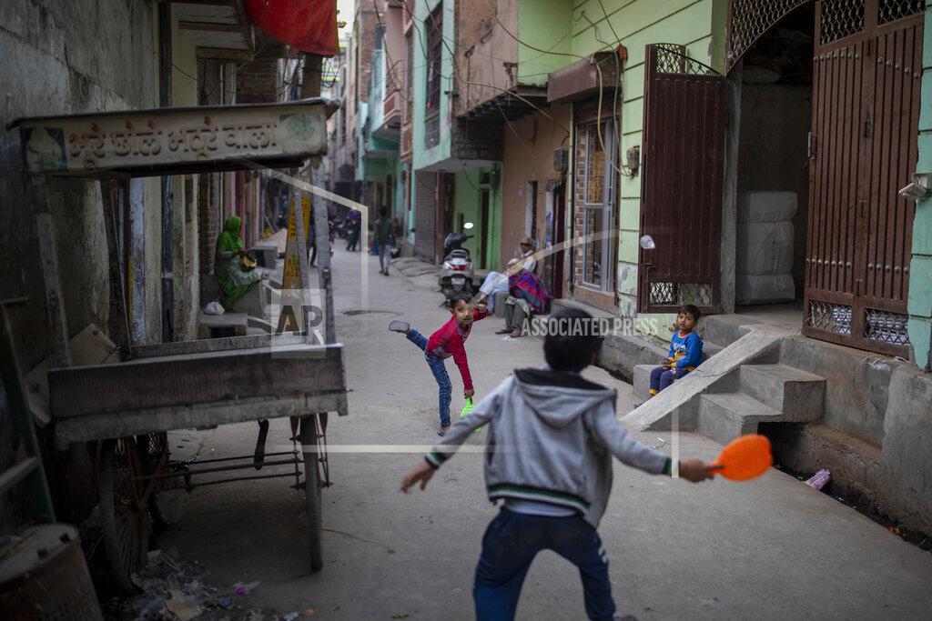 Altaf Qadri Children play in an alleyway in North Ghonda neighborhood, one of the worst riot affected area during the February 2020 communal riots, in New Delhi, India, Friday, Feb. 19, 2021. As the first anniversary of bloody communal riots that convulsed the Indian capital approaches, Muslim victims are still shaken and struggling to make sense of their struggle to seek justice. (AP Photo/Altaf Qadri)