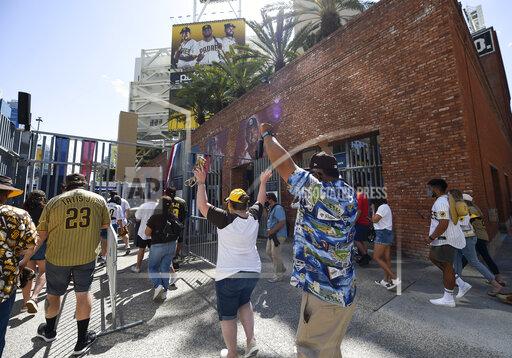Denis Poroy Baseball fans celebrate as the gates open up before a baseball game between the Arizona Diamondbacks and the San Diego Padres Thursday, April 1, 2021, on opening day in San Diego. (AP Photo/Denis Poroy)