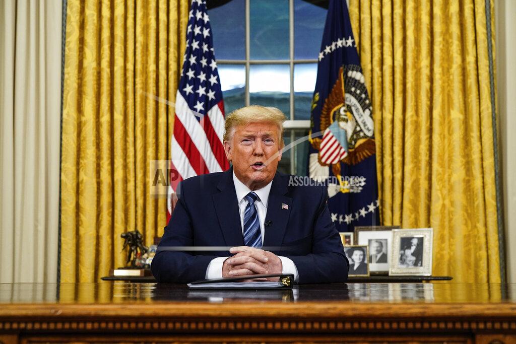 Doug Mills FILE - In this March 11, 2020, file photo President Donald Trump speaks in an address to the nation from the Oval Office at the White House about the coronavirus in Washington. For only the second time as president, Trump addressed the nation in a formal Oval Office speech on March 11. The U.S., he told Americans, would “expeditiously defeat this virus.” (Doug Mills/The New York Times via AP, Pool, File)