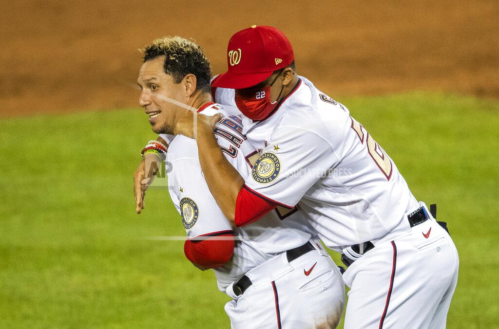 Manuel Balce Ceneta Washington Nationals Juan Soto (22) celebrates with teammate Asdrubal Cabrera, left, after winning 5-3 in a baseball game against the New York Mets in Washington, Tuesday, Aug. 4, 2020. (AP Photo/Manuel Balce Ceneta)