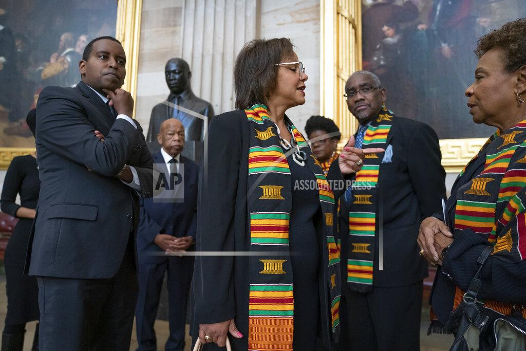 J. Scott Applewhite FILE - In this Oct. 24, 2019, file photo members of the Congressional Black Caucus gather for a memorial ceremony for the late Maryland Rep. Elijah Cummings, at the Capitol in Washington. From left are Rep. Joe Neguse, D-Colo., Rep. John Lewis, D-Ga., Rep. Robin Kelly, D-Ill., Rep. Gwen Moore, D-Wis., Rep. Gregory Meeks, D-N.Y., and Rep. Barbara Lee, D-Calif. The Congressional Black Caucus PAC is endorsing Joe Biden’s presidential bid, further cementing his support among the nation’s influential black political leadership. Black voters have long anchored the former vice president’s White House bid with decisive wins in South Carolina and on Super Tuesday. The chairman of the Congressional Black Caucus political action committee is New York congressman Gregory Meeks, who tells The Associated Press there’s “no question” Biden is the right person to lead the country.(AP Photo/J. Scott Applewhite, File)