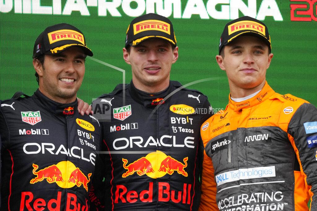 Luca Bruno Red Bull driver Max Verstappen, center, of the Netherlands, winner of the Emilia Romagna Formula One Grand Prix, celebrates on the podium with second placed Red Bull driver Sergio Perez, left, of Mexico, and third placed McLaren driver Lando Norris, of Britain, at the Enzo and Dino Ferrari racetrack, in Imola, Italy, Sunday, April 24, 2022. (AP Photo/Luca Bruno)