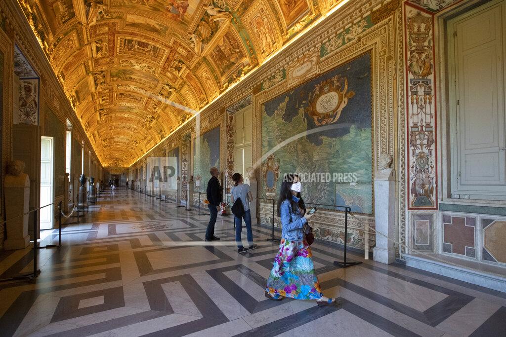 Alessandra Tarantino Visitors admire the Gallery of Maps as the Vatican Museum reopened, in Rome, Monday, June 1, 2020. The Vatican Museums reopened Monday to visitors after three months of shutdown following COVID-19 containment measures.