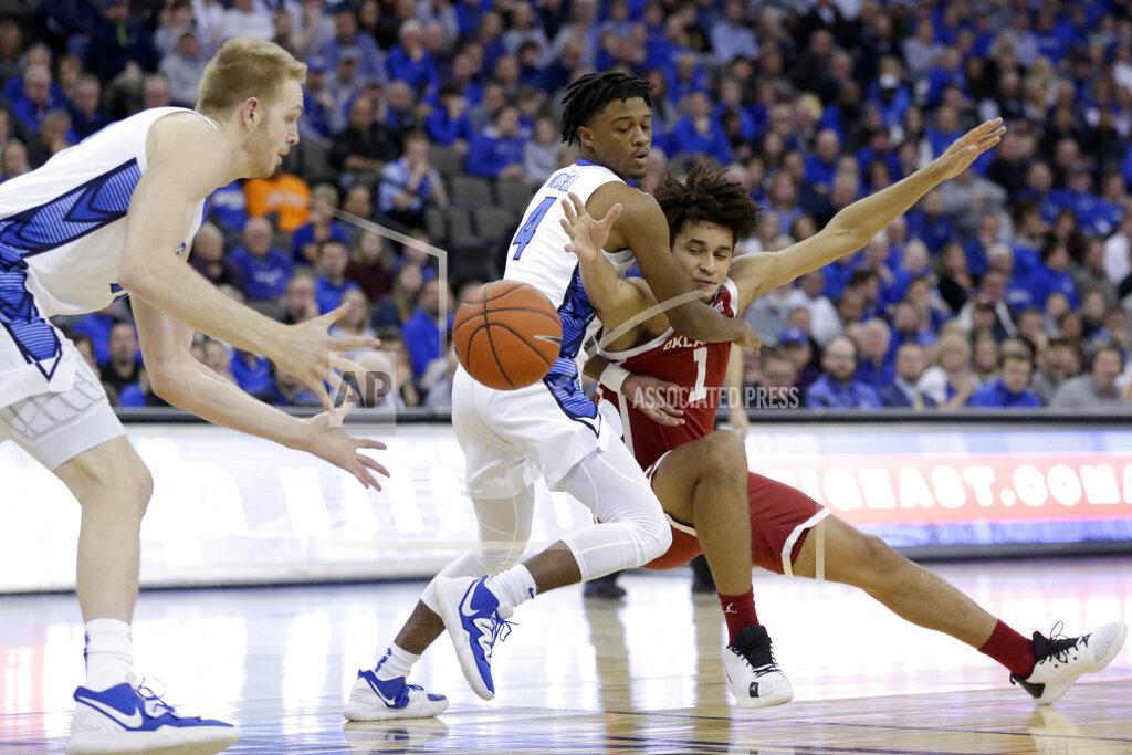 Oklahoma's Jalen Hill (1) loses the ball to Creighton's Kelvin Jones, left, while defended by Shereef Mitchell (4), during the first half of an NCAA college basketball game in Omaha, Neb., Tuesday, Dec. 17, 2019. (AP Photo/Nati Harnik)