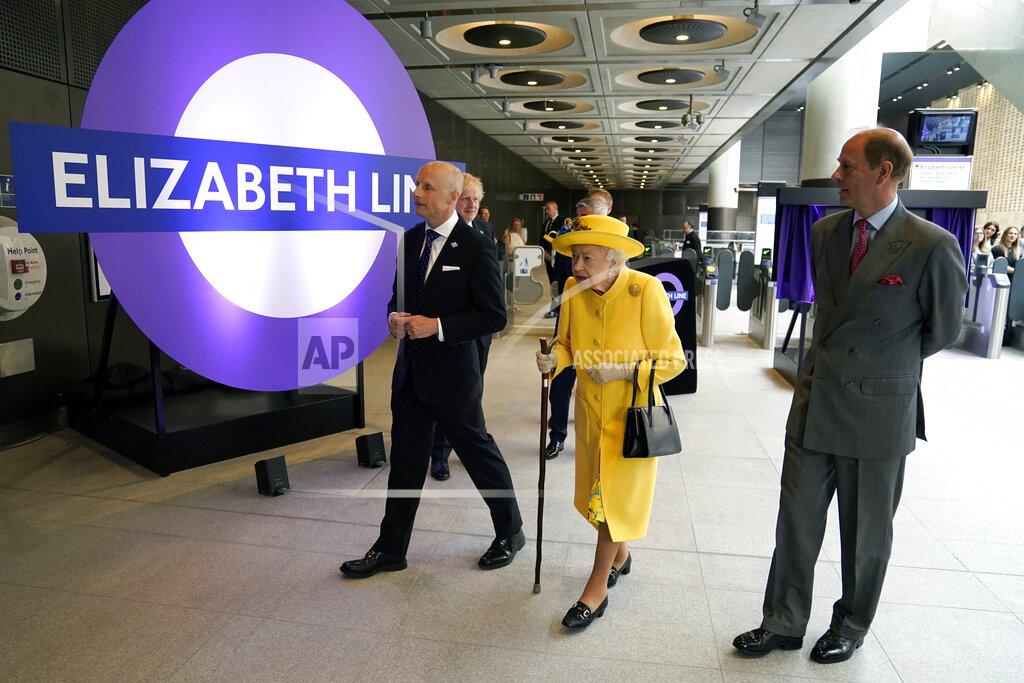 Andrew Matthews Britain's Queen Elizabeth II and Prince Edward, right, talks with Transport for London commissioner Andy Byford, left, at Paddington station in London meets staff of the Crossrail project, as well as Elizabeth Line staff who will be running the railway, to mark the completion of London's Crossrail project, Tuesday, May 17, 2022. (Andrew Matthews/Pool via AP)