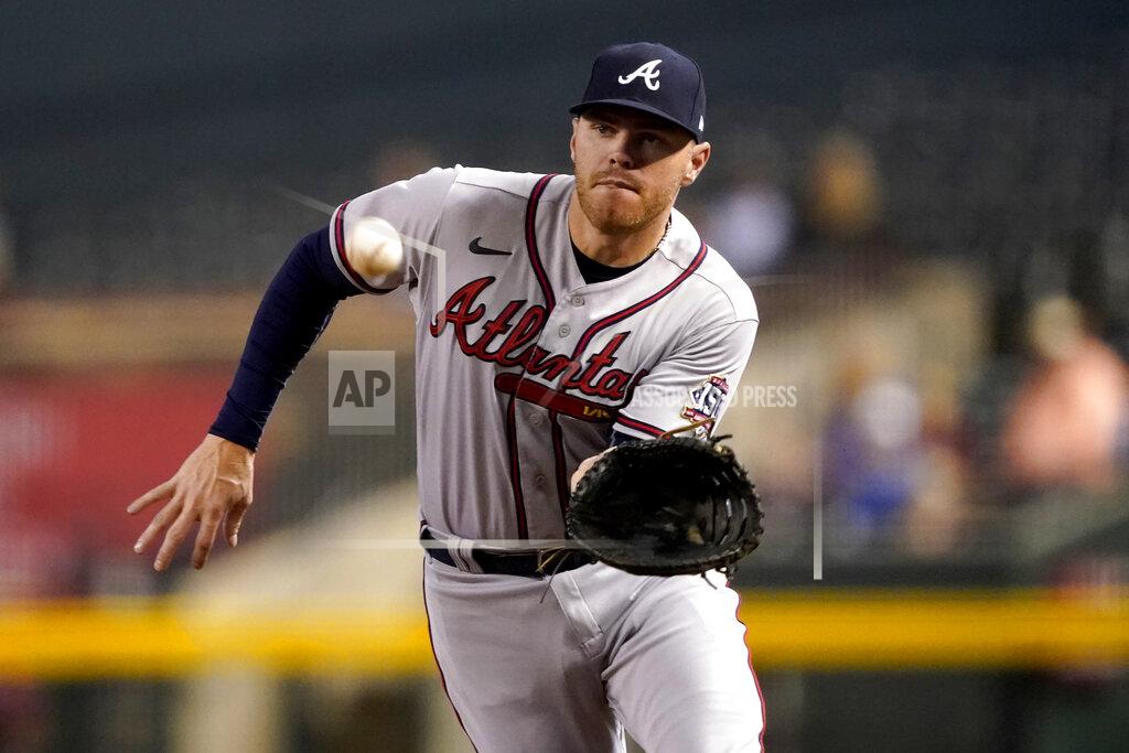 Matt York Atlanta Braves Freddie Freeman fields a ground out hit by Arizona Diamondbacks David Peralta during the first inning of a baseball game, Monday, Sept. 20, 2021, in Phoenix. (AP Photo/Matt York)