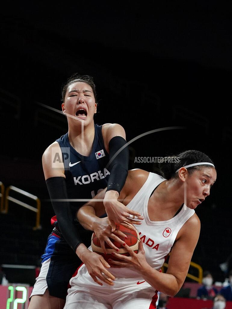 Charlie Neibergall Canada's Natalie Achonwa (11), right, steals the ball from South Korea's Ji Su Park (19) during women's basketball preliminary round game at the 2020 Summer Olympics, Thursday, July 29, 2021, in Saitama, Japan. (AP Photo/Charlie Neibergall)