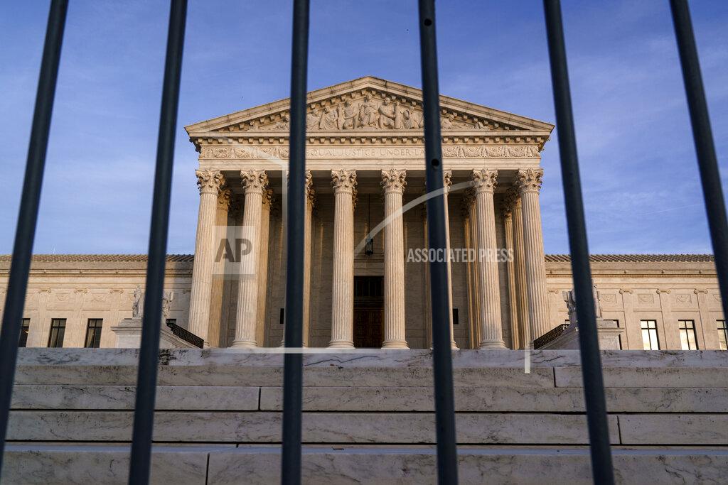 J. Scott Applewhite In this Nov. 5, 2020, file photo, the Supreme Court in Washington. The Supreme Court has rejected Republicans' last-gasp bid to reverse Pennsylvania’s certification of President-elect Joe Biden’s victory in the electoral battleground. The court without comment Tuesday, Dec. 8, refused to call into question the certification process in Pennsylvania. (AP Photo/J. Scott Applewhite)