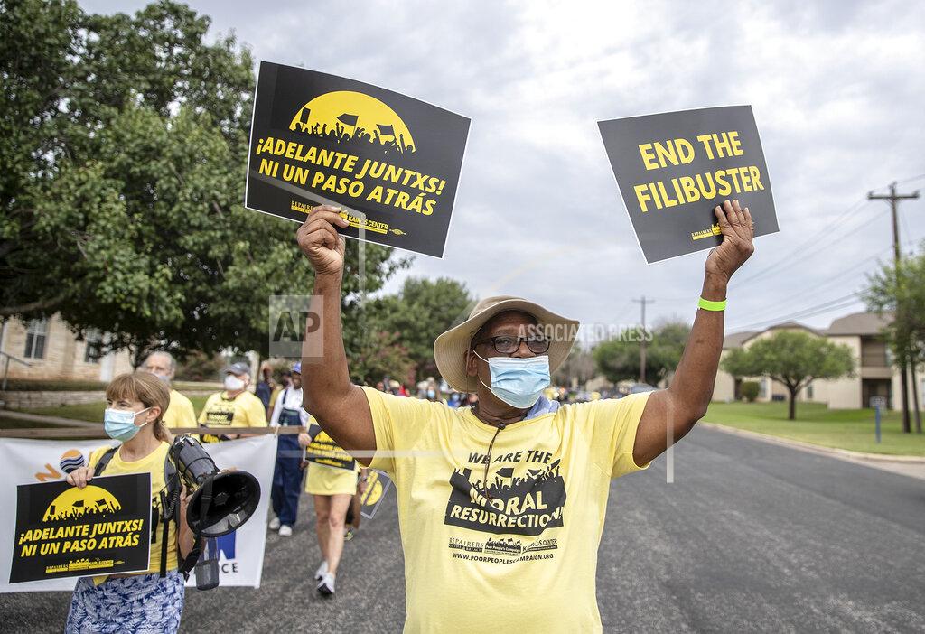 Ricardo B. Brazziell Willie Richardson walks with the Poor People's Campaign as they gathered together at Christ Lutheran, in Georgetown, Texas to participate in a Selma-style march for democracy from Georgetown, Texas to the Texas State Capitol in downtown Austin. On Wednesday, July 28, 2021 the group made a stop at Good Hope church in Round Rock and will end with a rally at the Capitol at 10 am on July 31st. (Ricardo B. Brazziell/Austin American-Statesman via AP)