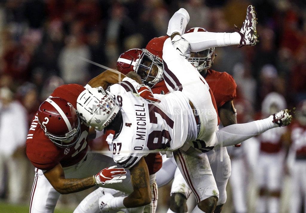 Butch Dill Mississippi State wide receiver Osirus Mitchell (87) is tackled by Alabama defensive back Patrick Surtain II (2) and linebacker Mack Wilson (30) during the second half of an NCAA college football game, Saturday, Nov. 10, 2018, in Tuscaloosa, Ala. (AP Photo/Butch Dill)