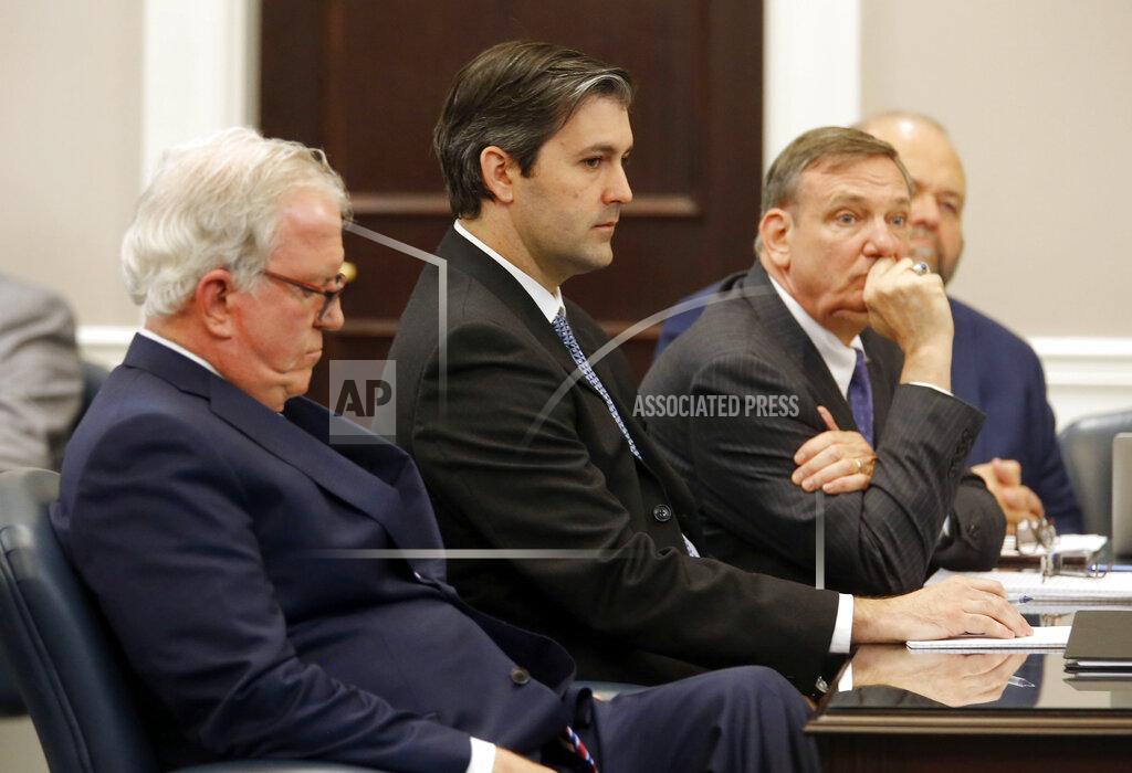 Grace Beahm FILE - In this Dec. 5, 2016 file photo, defense attorneys Andy Savage, left, Don McCune, and Miller Shealy, right, sit around former North Charleston police officer Michael Slager at theCharleston County court in Charleston, S.C. Slager, who is serving 20 years in prison for killing an unarmed Black man who was running away from a traffic stop, said his lawyer never told him about a plea offer from prosecutors that could have cut years off his sentence and is asking for a new sentence in federal court this week. (Grace Beahm/Post and Courier via AP, Pool)