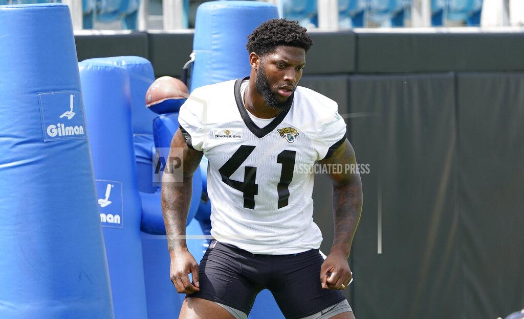 John Raoux Jacksonville Jaguars Josh Allen (41) performs a drill at an NFL football practice, Monday, May 23, 2022, in Jacksonville, Fla. (AP Photo/John Raoux)