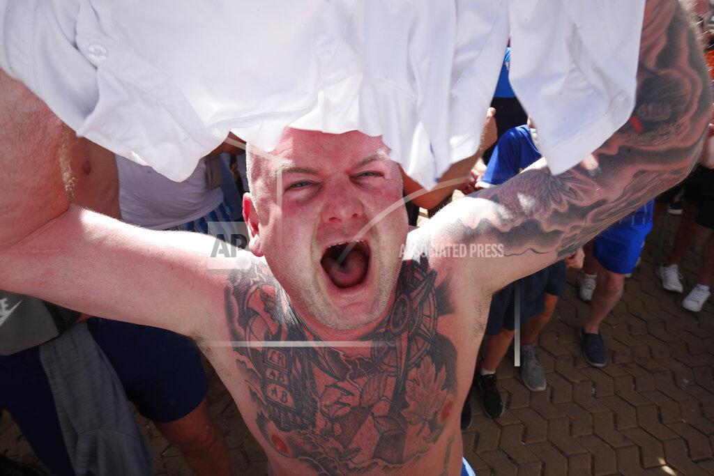 Angel Fernandez A Glasgow Ranger supporter cheers outside a bar in downtown Seville, Spain, Tuesday, May 17, 2022. Eintracht Frankfurt will play Glasgow Rangers in the Europa League final Wednesday evening in Seville. (AP Photo/Angel Fernandez)