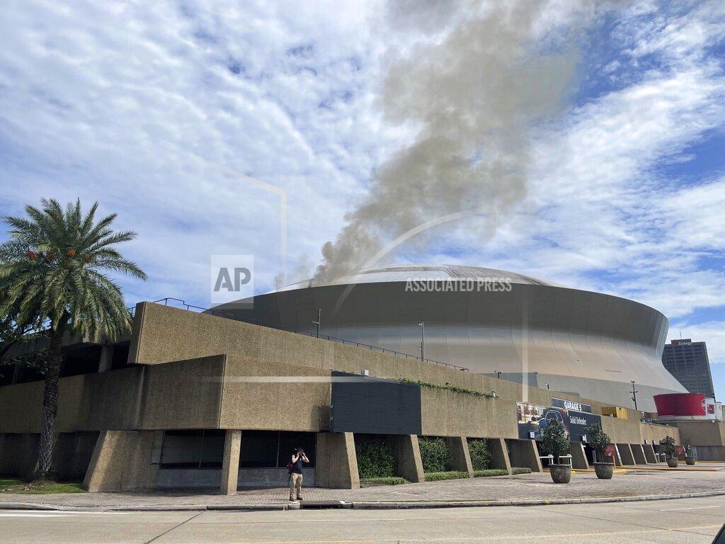 Chief C Mickal This photo provided by New Orleans fire department shows smoke coming from roof at New Orleans' Superdome on Tuesday, Sept. 21, 2021 in New Orleans. The New Orleans Fire Department says it responded to a fire about 1 p.m. Tuesday on the roof. A short time later it appeared under control. (Chief C Mickal/New Orleans Fire Department via AP)