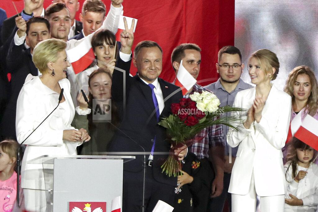 Czarek Sokolowski Incumbent President Andrzej Duda flashes a victory sign in Pultusk, Poland, Sunday, July 12, 2020. An exit poll in Poland's presidential runoff election shows a tight race that is too close to call between the conservative incumbent, Andrzej Duda, and the liberal Warsaw mayor, Rafal Trzaskowski.(AP Photo/Czarek Sokolowski)