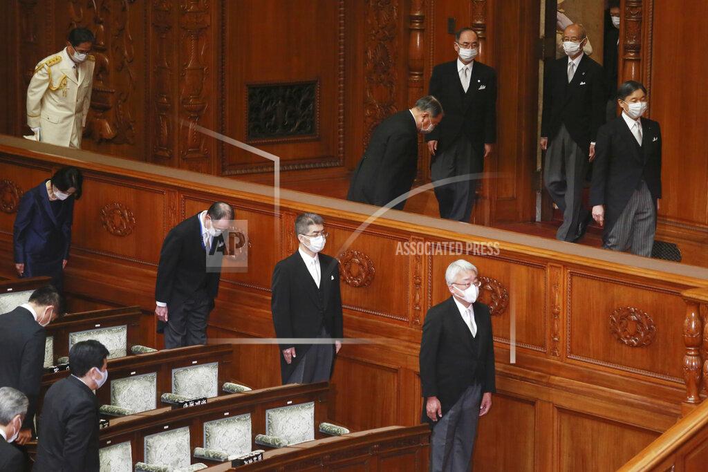 Koji Sasahara Japan's Emperor Naruhito, right, wearing a face mask to protect against the coronavirus arrives to read a statement to formally open an extraordinary Diet session at the upper house of parliament in Tokyo, Monday, Oct. 26, 2020. (AP Photo/Koji Sasahara)