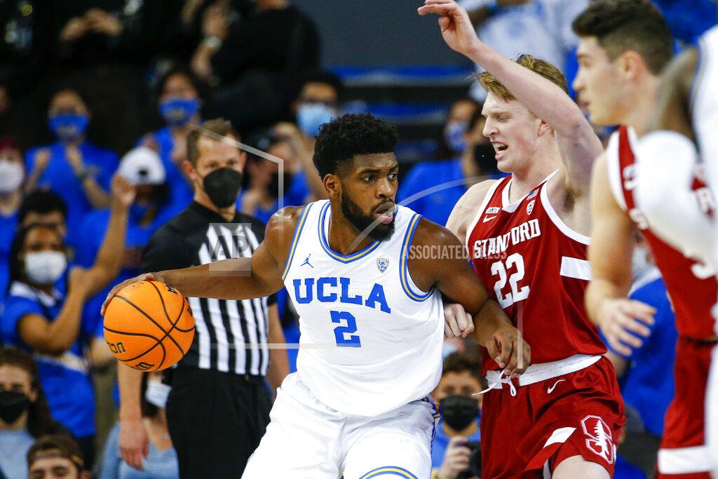 Ringo H.w. Chiu UCLA forward Cody Riley (2) dribbles against Stanford forward James Keefe (22) in the first half of an NCAA college basketball game Saturday, Jan. 29, 2022, in Los Angeles. (AP Photo/Ringo H.W. Chiu)