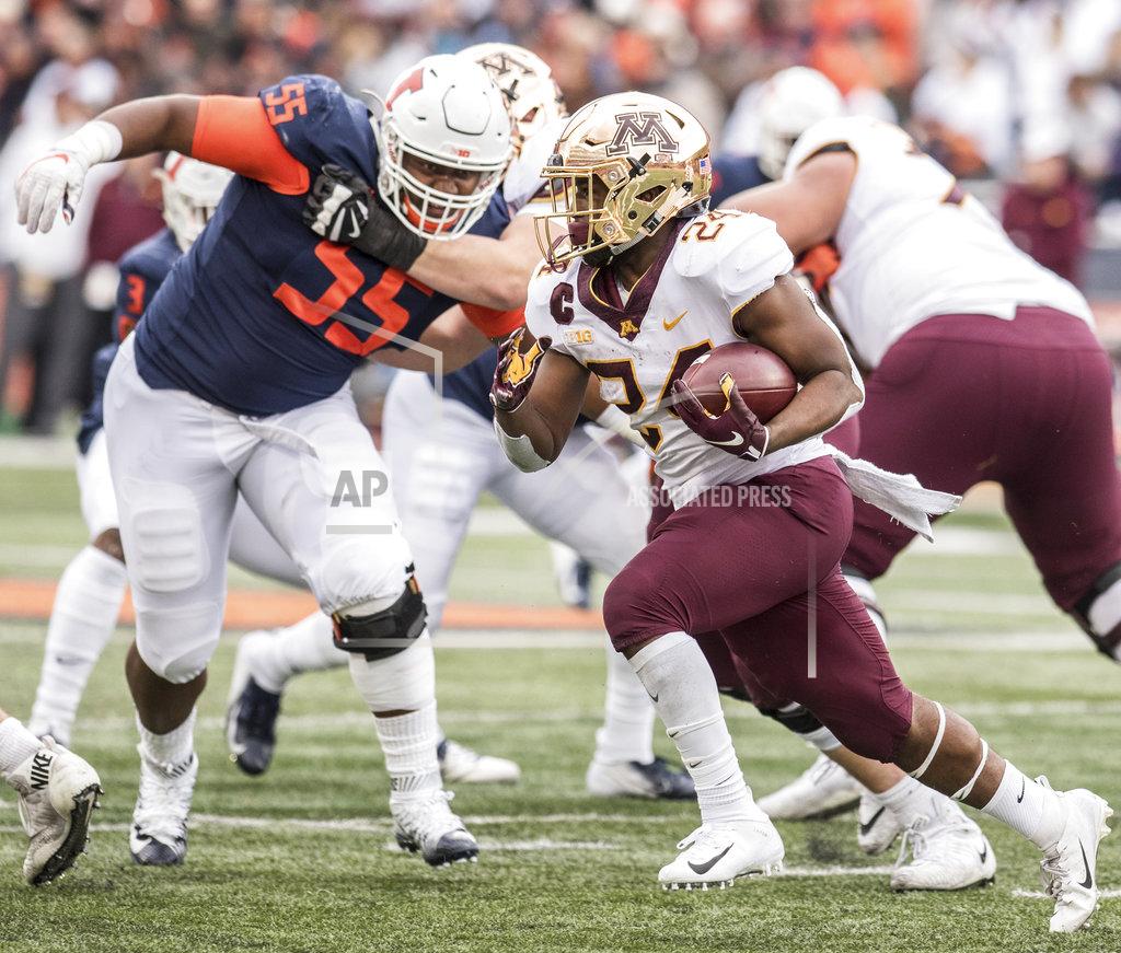 Holly Hart Minnesota's Mohamed Ibrahim (24) runs as Illinois' Jamal Milan (55) defends in the first half of an NCAA college football game, Saturday, Nov. 3, 2018, in Champaign, Ill. (AP Photo/Holly Hart)
