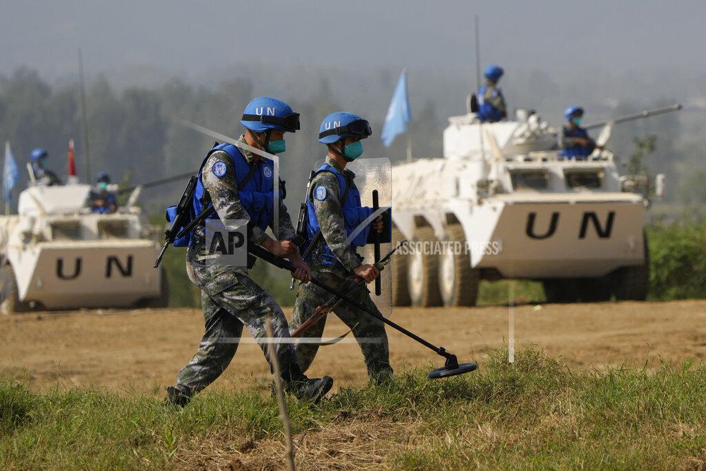 Ng Han Guan Chinese United Nations troop practice sweeping for mines during the Shared Destiny 2021 drill at the Queshan Peacekeeping Operation training base in Queshan County in central China's Henan province Wednesday, Sept. 15, 2021. Peacekeeping troops from China, Thailand, Mongolia and Pakistan took part in the 10 days long exercise that field reconnaissance, armed escort, response to terrorist attacks, medical evacuation and epidemic control. (AP Photo/Ng Han Guan)