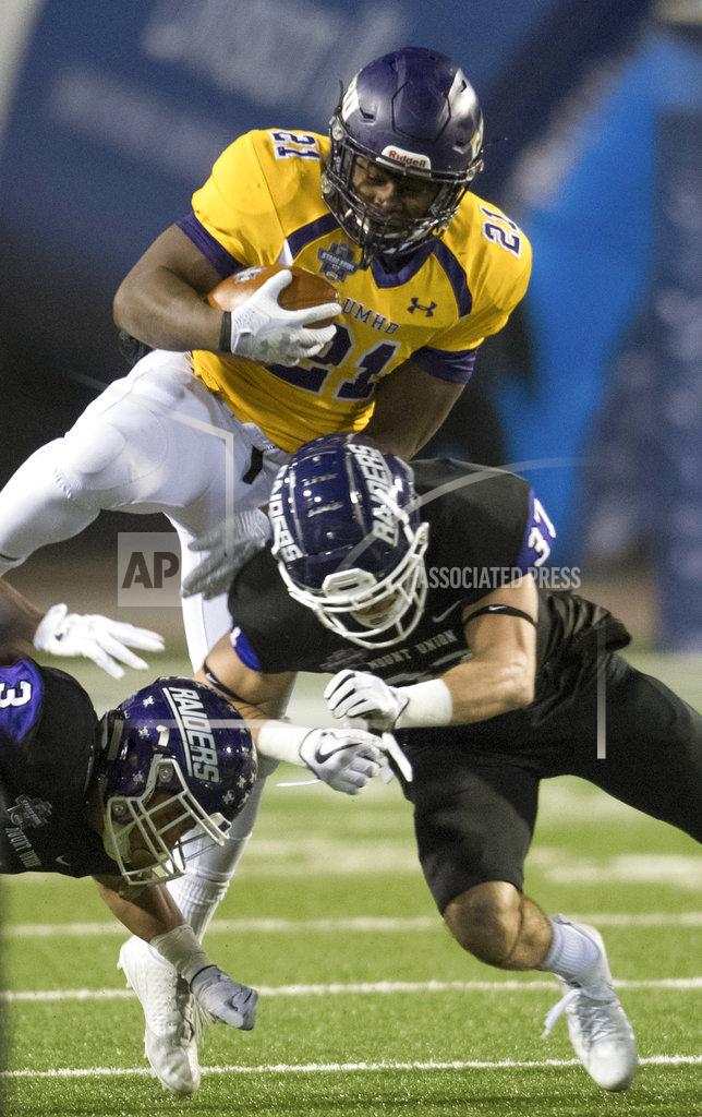 Lee Luther Jr. FILE - In this Dec. 15, 2017, file photo, Mary Hardin-Baylor's Markeith Miller (21) gets tackled by Mount Union's Kollyn Crenshaw (3) and Nick Brish (37) during the first half of the Amos Alonzo Stagg Bowl NCAA Division III college football championship, in Salem, Va. Markeith Miller was named to The Associated Press Division III All-America Team, Thursday, Dec. 13, 2018. (AP Photo/Lee Luther Jr., FIle)