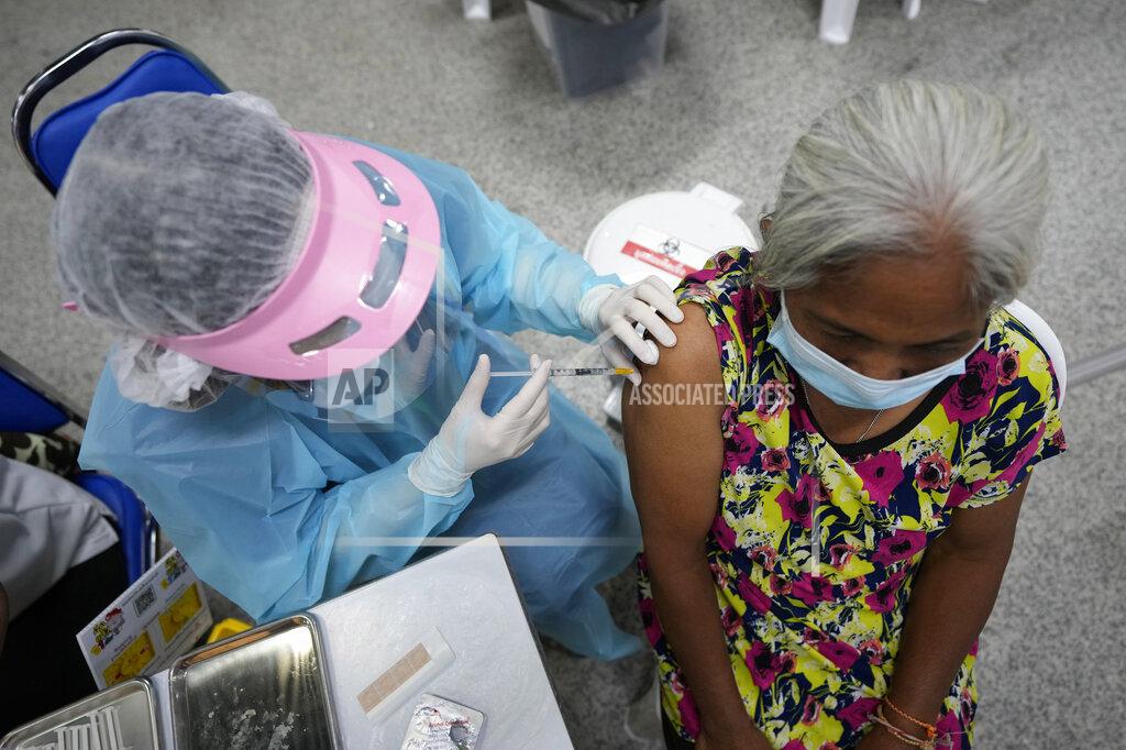Sakchai Lalit A health worker administers a shot of the AstraZeneca COVID-19 vaccine at the Central Vaccination Center in Bangkok, Thailand, Thursday, July 22, 2021. (AP Photo/Sakchai Lalit)