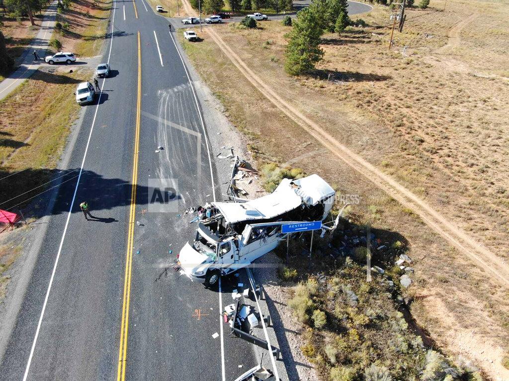 Uncredited FILE - This Friday, Sept. 20, 2019, photo provided by the Utah Highway Patrol shows a tour bus carrying Chinese-speaking tourists after it crashed near Bryce Canyon National Park in southern Utah, killing at least four people and critically injuring multiple others. The families of Chinese tourists killed or injured in a 2019 tour bus crash say the state's design and maintenance failed to keep the remote highway safe. More than a dozen people were thrown from the bus when the driver drifted off the road and overcorrected when he steered back, sending the bus into a rollover. A lawsuit alleges the state failed to post warning signs, had a road design that left little room for error and included no rumble strip to warn drivers. The Utah Department of Transportation declined to comment. U.S. regulators have previously ruled out highway design, signage and other characteristics as factors. (Utah Highway Patrol via AP, File)