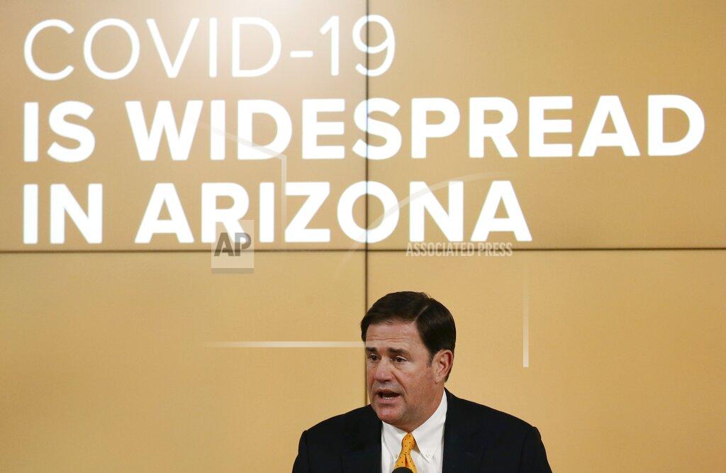 Arizona Republican Gov. Doug Ducey speaks about the latest coronavirus data at a news conference Thursday, June 25, 2020, in Phoenix. (AP Photo/Ross D. Franklin, Pool)