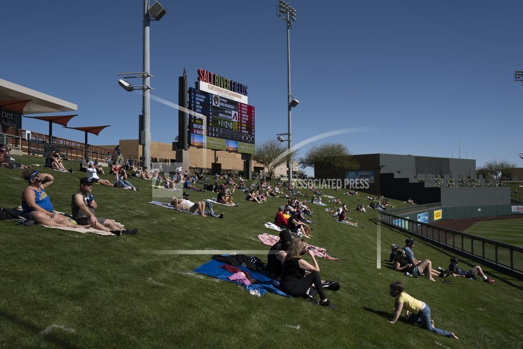 Jae C. Hong Socially distanced fans watch a spring baseball game between the Arizona Diamondbacks and the Milwaukee Brewers in Scottsdale, Ariz., Monday, March 1, 2021. (AP Photo/Jae C. Hong)