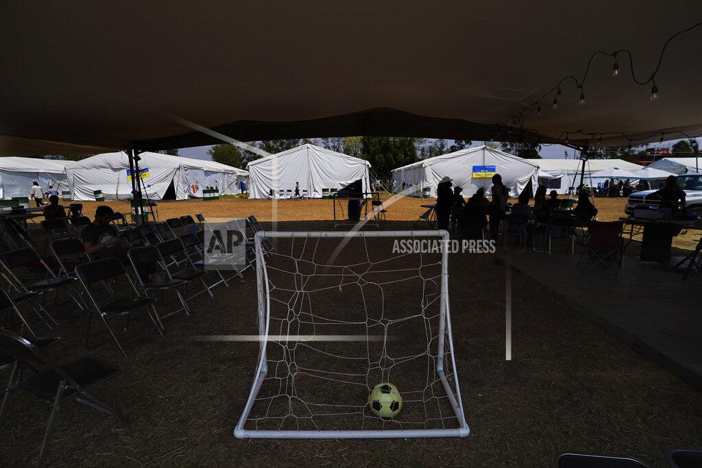 Marco Ugarte A soccer ball sits in a portable soccer goal at a camp for Ukrainian refugees in the Iztapalapa borough of Mexico City, Tuesday, May 24, 2022. Mexico City will close the camp that has hosted hundreds of Ukrainian refugees for the past month. Now that a U.S. program vetting refugees and then allowing them to fly to the U.S. is operational, authorities say the camp is no longer needed. (AP Photo/Marco Ugarte)