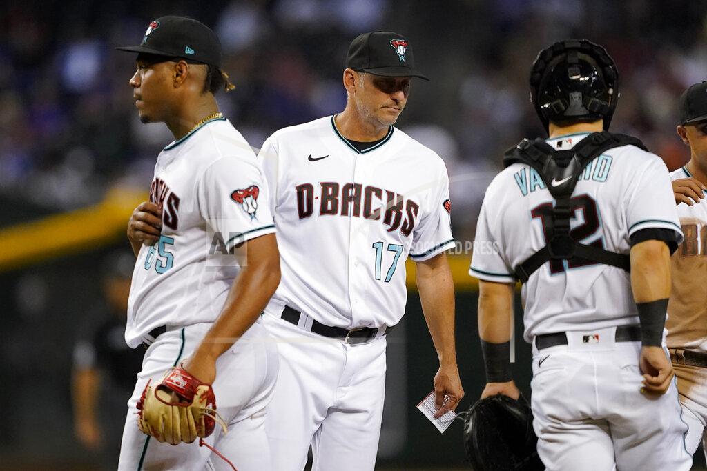 Matt York Arizona Diamondbacks manager Torey Lovullo (17) pulls pitcher Luis Frias (65) from the game during the seventh inning of a baseball game against the Los Angeles Dodgers, Thursday, May 26, 2022, in Phoenix. (AP Photo/Matt York)