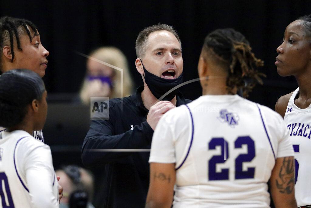Michael Wyke Stephen F. Austin head coach Mark Kellogg talks with his players during the second half of an NCAA college basketball game against Sam Houston State for the Southland Conference women's tournament championship Sunday, March 14, 2021, in Katy, Texas. (AP Photo/Michael Wyke)