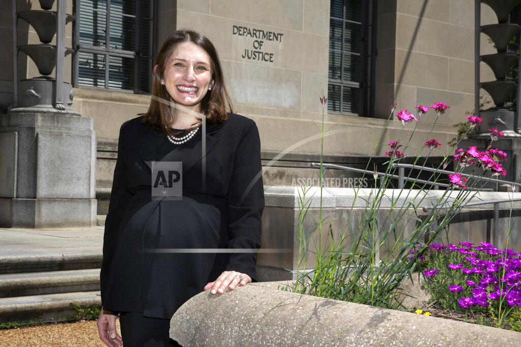 Jacquelyn Martin Attorney Erica Ross poses for a portrait, Monday, May 4, 2020, outside the Department of Justice in Washington, after Ross became the first attorney to argue in the first arguments that the Supreme Court has argued via telephone. (AP Photo/Jacquelyn Martin)