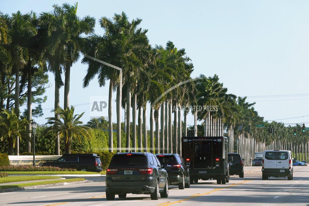 President Donald Trump's motorcade arrives at Trump International Golf Club in West Palm Beach, Fla., Wednesday, Dec. 30, 2020. (AP Photo/Patrick Semansky)
