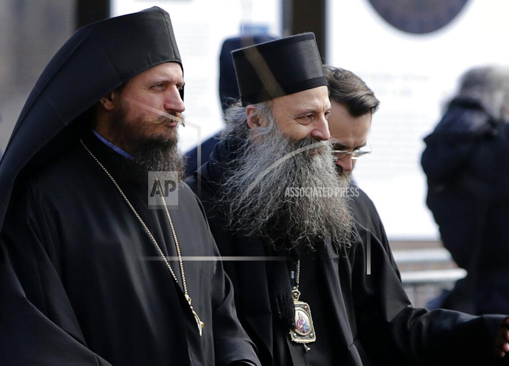 Darko Vojinovic Serbian Orthodox Church bishop Porfirije, centre, leaves the St. Sava temple in Belgrade, Serbia, Thursday, Feb. 18, 2021. Serbian Orthodox Church gathers in closed session to pick a new Patriarch, following the death of old one Irinej. Irinej died last year of covid, following the outbreak of virus among church officials in Belgrade. (AP Photo/Darko Vojinovic)