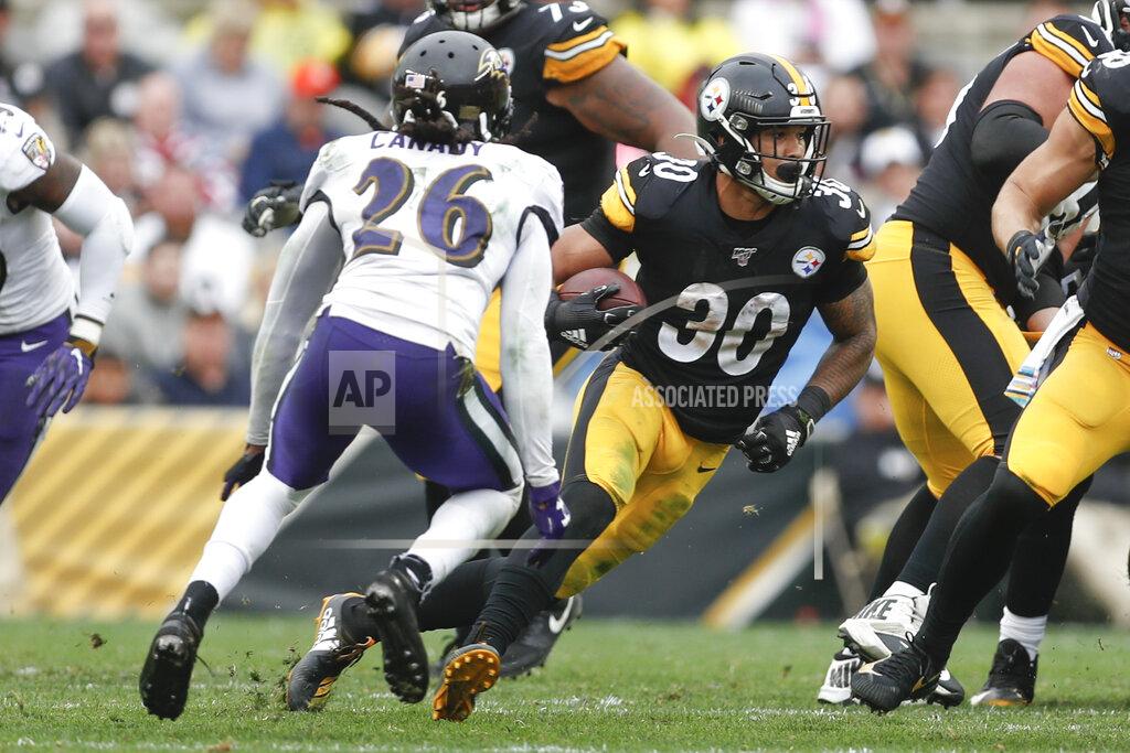 Don Wright Pittsburgh Steelers running back James Conner (30) runs away from Baltimore Ravens cornerback Maurice Canady (26) during the second half of an NFL football game, Sunday, Oct. 6, 2019, in Pittsburgh. The Ravens won 26-23. (AP Photo/Don Wright)