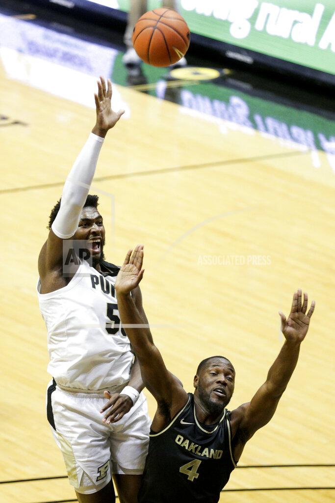 Nikos Frazier Purdue forward Trevion Williams (50) goes up for two above Oakland forward Daniel Oladapo (4) during the first half of an NCAA college basketball game Tuesday, Dec. 1, 2020 in West Lafayette, Ind. (Nikos Frazier/Journal & Courier via AP)
