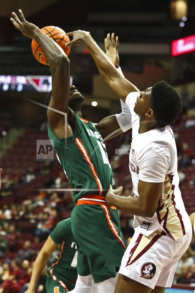 Phil Sears Miami center Favour Aire (12) has his shot rejected by Florida State guard Chandler Jackson (0) in the second half of an NCAA college basketball game in Tallahassee, Fla., Tuesday, Jan. 24, 2023. (AP Photo/Phil Sears)