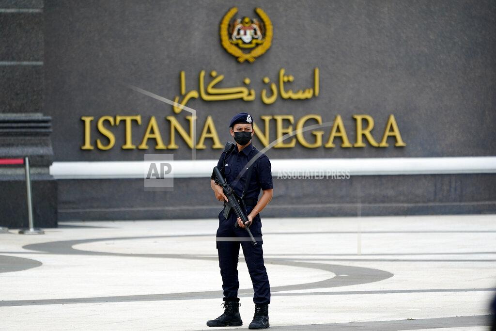 Vincent Thian Armed police wearing a face mask to help curb the spread of the coronavirus stands outside National Palace in Kuala Lumpur, Malaysia, Sunday, Oct. 25, 2020. Malay rulers hold a special meeting on Sunday to discuss the government's plan to declare an emergency to tackle the worsening COVID-19 situation. (AP Photo/Vincent Thian)